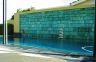 The water wall fulfils a number of functions, it provides a dynamic backdrop to the pool, it diverts the onlooker’s eye from the neighbour’s house and it provides the focal point for the new residence.